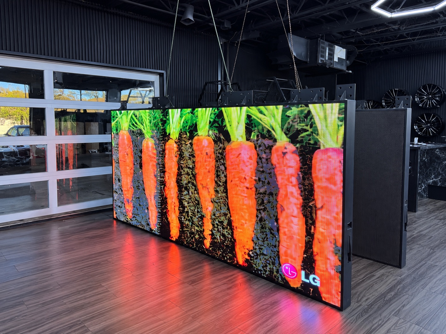 Greenfield Motors indoor LED display showing vivid carrot imagery