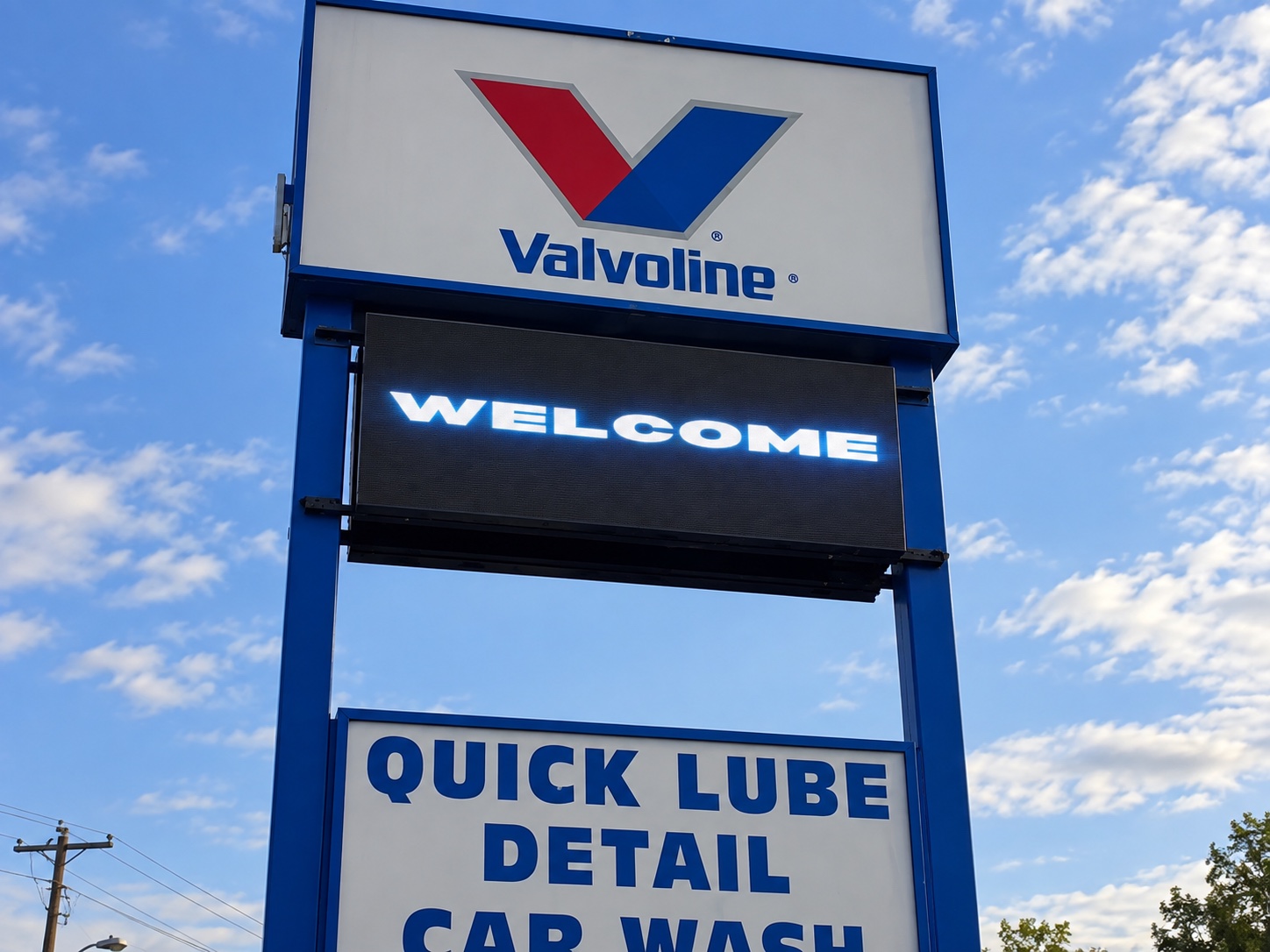 Port Huron Valvoline LED pylon sign displaying a welcome message