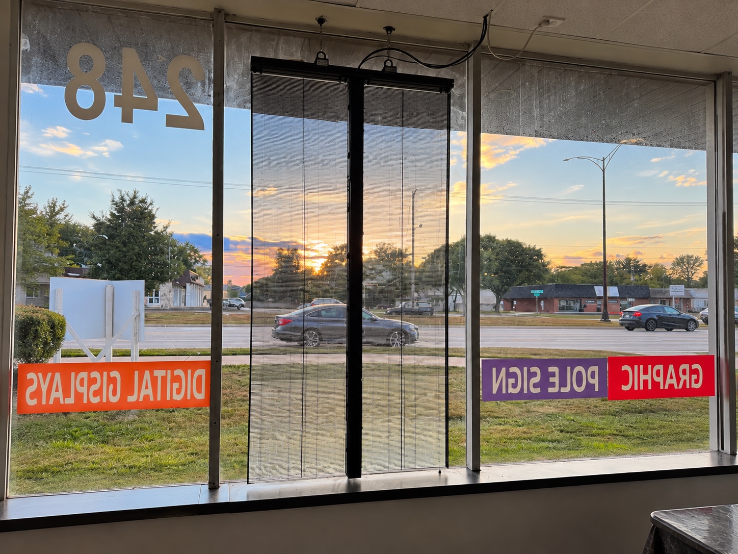 Wide interior view of the transparent LED window installation at SignLab Troy