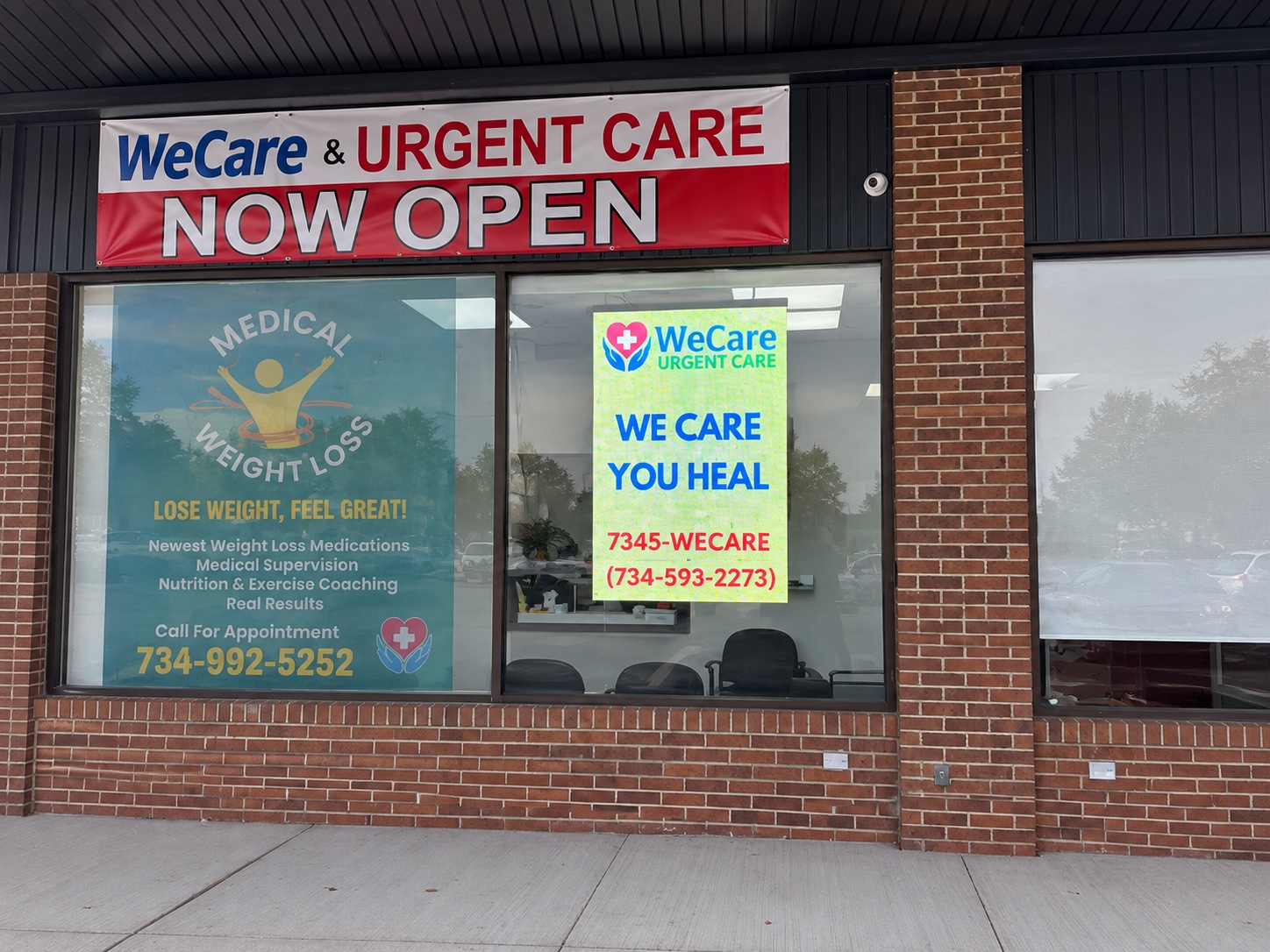 WeCare Urgent Care storefront with a transparent LED display and medical messaging