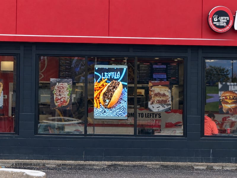 PixaClear LED transparent window advertising at Lefty's Famous Cheesesteaks in Livonia, Michigan